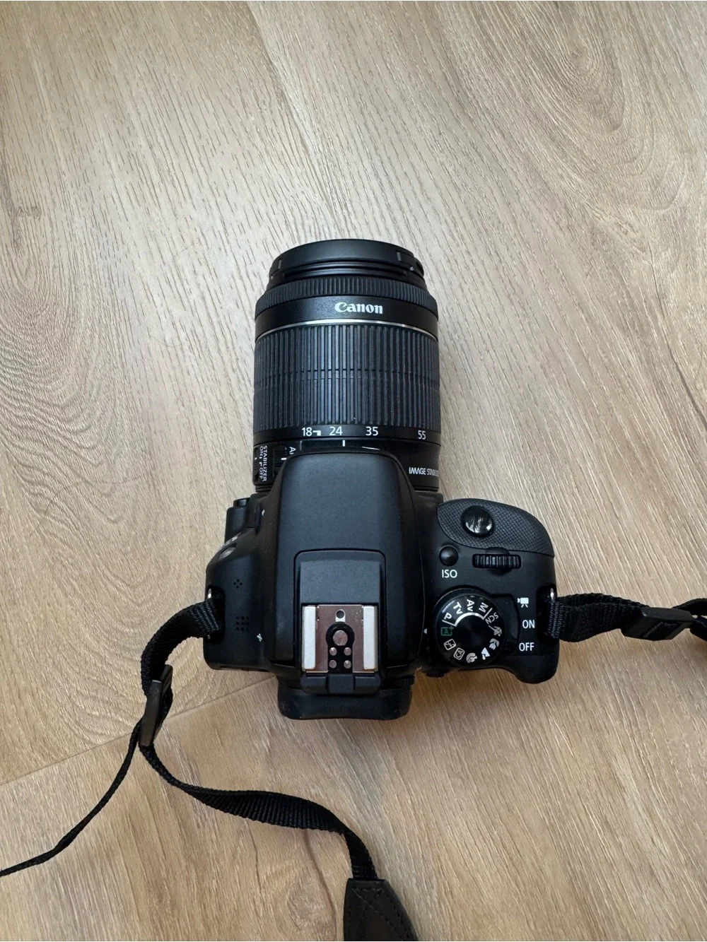 Canon DSLR Camera in Black with Black Zoom Lens